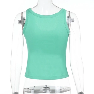 Detail view of mint green ribbed crop top back showing slim fit and textured fabric