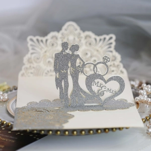 Elegant laser-cut wedding invitation featuring silver glitter Mr & Mrs silhouettes