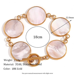 Detail showing 18K gold stainless steel OT buckle bracelet with mother of pearl inlay