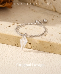 Detail of adjustable S925 silver chain ring with a faceted clear crystal pendant