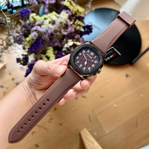 Detailed shot of brown silicone strap and square metal dial of the VIKEC men's watch