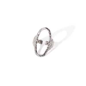 Macro shot of silver open ring with unique irregular hammered texture on white background