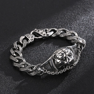 Detail of vintage silver tiger head stainless steel bracelet with chunky curb chain links