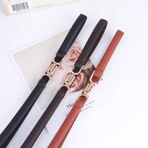 Three minimalist PU leather skinny belts in black and brown with gold geometric buckles
