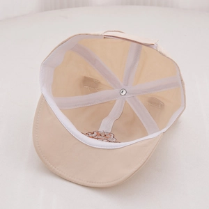 Detailed interior of infant sun hat showing breathable mesh support and adjustable strap