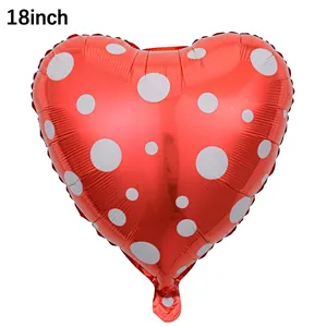 Detail of 18 inch red heart-shaped foil balloon with white polka dots for Valentine's Day
