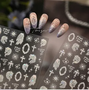 Detail of white dream unicorn nail stickers with holographic star and cross patterns