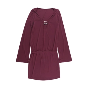 Detailed close-up of deep V-neckline with silver metal ring on burgundy dress