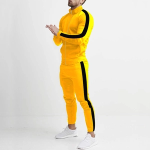 Side view of men's slim fit yellow tracksuit with black stripes and stand-up collar