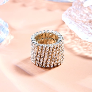 Macro shot of silver and gold plated magic ring bracelet with sparkling rhinestones