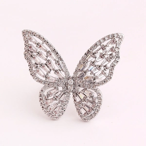 Macro shot of silver butterfly ring with micro-pave cubic zirconia and hollow details