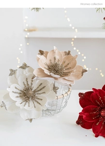 Detail of elegant velvet Christmas magnolia flowers with sparkling gold glitter edges