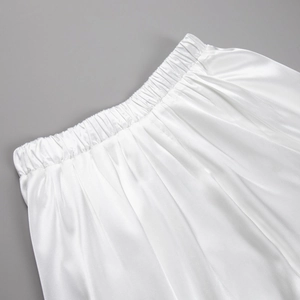 Close-up of the elastic waistband on this elegant white satin high-waist maxi skirt