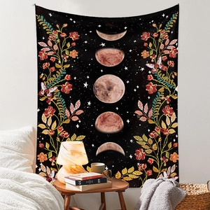 Detailed view of moon phase tapestry with floral patterns hanging over a bed in a bedroom