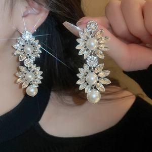 Elegant silver tassel earrings with crystal flower petals and artificial pearls for women