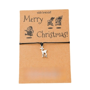 Christmas wish bracelet featuring a silver reindeer charm on black cord with a gift card