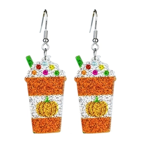 Detail of glitter acrylic pumpkin spice latte earrings with colorful sprinkles and green straw