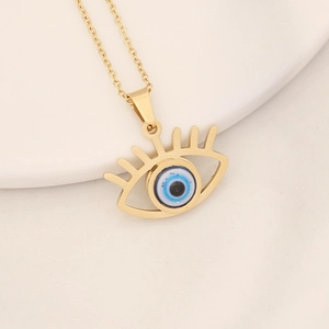 Golden stainless steel necklace with blue evil eye pendant on a white surface