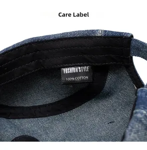 Macro view of the 100% cotton care label inside the washed denim baseball cap