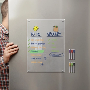 Detailed view of clear acrylic weekly planner on a fridge with six colorful magnetic pens