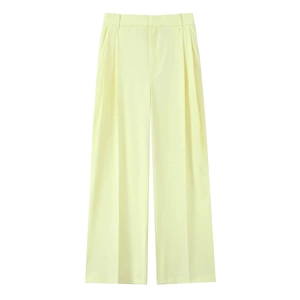 Flat lay of pale yellow high-waisted wide-leg trousers on a solid white background
