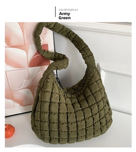 Detail of army green quilted puffer cloud bag with soft bubble texture and shoulder strap