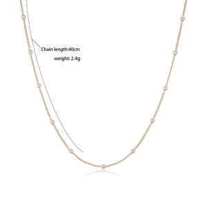 Detail showing gold plated flower necklace, 40cm chain length and 2.4g weight