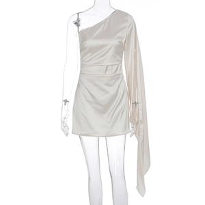 Detail of elegant champagne satin mini dress featuring a draped single-shoulder sleeve