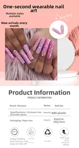 Detail of pink floral press-on nails featuring glitter accents and rhinestone decor