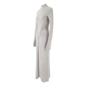 Detailed close-up of side waist ruching and draping on a slim high-neck maxi dress