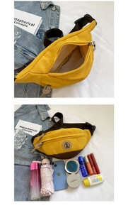 Detail showing high-capacity yellow canvas waist bag interior with daily essentials