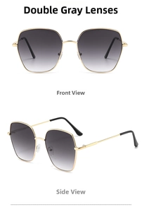 Detailansicht der großen Metall-Sonnenbrille mit grauem Verlaufsglas und goldenem Rahmen