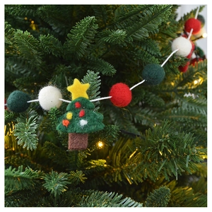 Detailed view of handmade wool felt Christmas tree garland with colorful felt balls