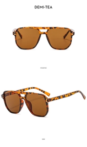 Close-up of demi-tea aviator sunglasses showing dual-bridge frame and tinted lenses