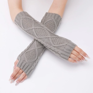 Detail of grey diamond-patterned knitted fingerless gloves for autumn and winter