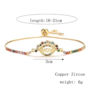 Detail of adjustable gold-plated MOM bracelet featuring colorful cubic zirconia heart charms