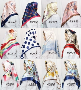 Collage of 12 printed satin square scarves showing various patterns and vibrant colors