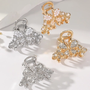 Set of four butterfly hair claws with pearls and rhinestones in gold and silver finishes