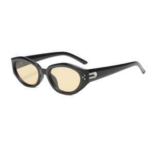 Retro black irregular cat-eye sunglasses with yellow lenses and metallic rivets