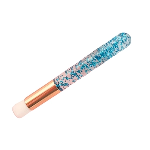 Portable eyelash cleansing brush with blue glitter handle and rose gold ferrule