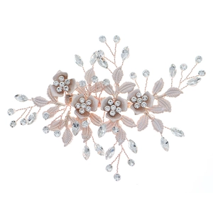 Rose gold floral hair clip with 3D metal flowers and sparkling crystals for bridal hair
