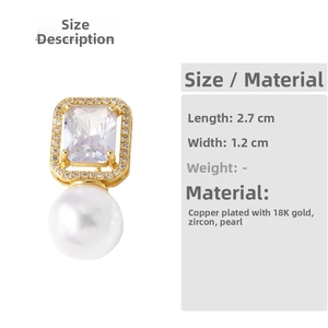 Detail view of 18k gold plated pearl earrings with rectangular zircon 2.7x1.2cm size