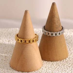 Minimalist stainless steel 18K gold and silver chain rings displayed on wooden stands