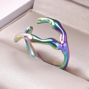 Macro shot of an irregular rainbow chrome lava ring displayed in a jewelry box