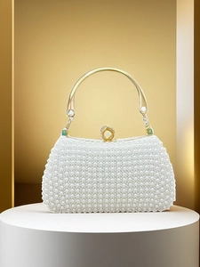 Elegant white pearl handbag with golden metal handle and diamond-encrusted lock for gala