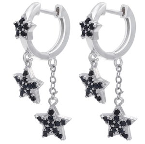 Detail of silver long star earrings featuring black zircon stones and fringe tassels