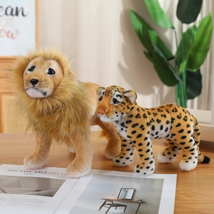 Realistic lion and leopard plush dolls standing on a wooden table for home decor