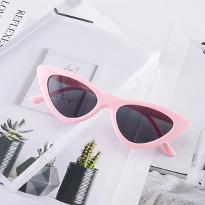 Fashionable pink cat eye sunglasses with grey lenses and retro small frame design