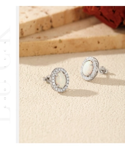 Detailed macro view of S925 sterling silver oval opal stud earrings with zircon halo