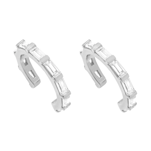 Macro shot of silver ear cuffs set with emerald-cut cubic zirconia in a step-cut row